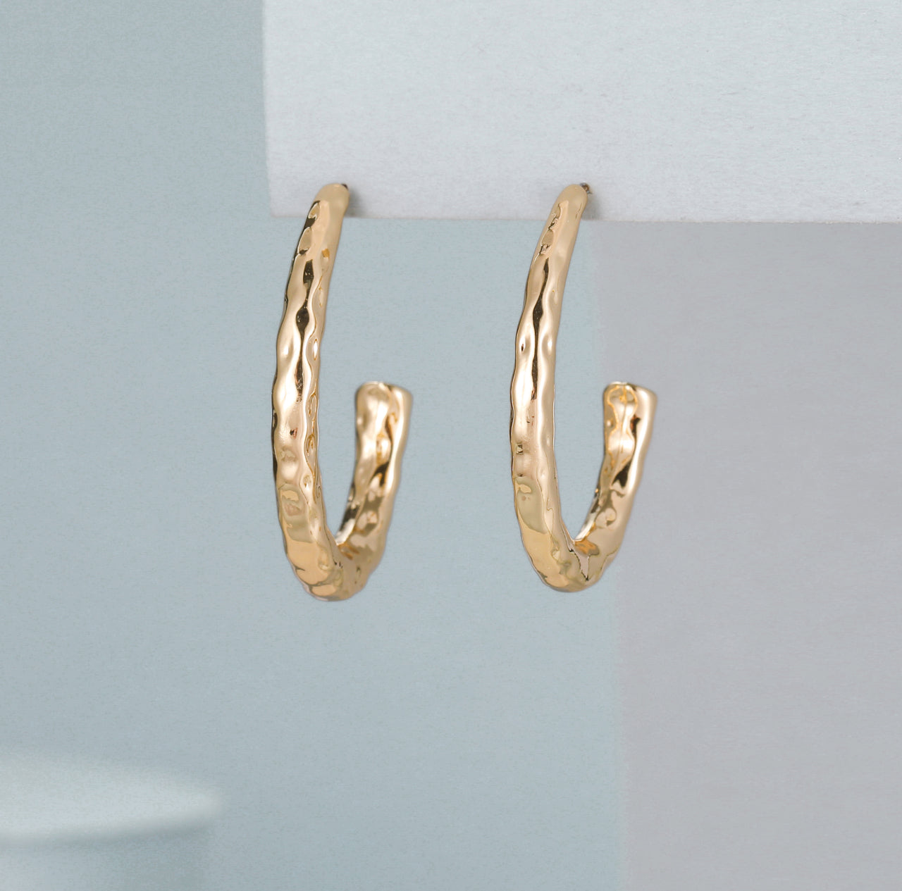 Topsie Gold Hammered Oval Hoop Earrings